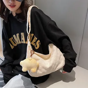 Cream waffle texture shoulder bag with star plush charm and zipper closure for women