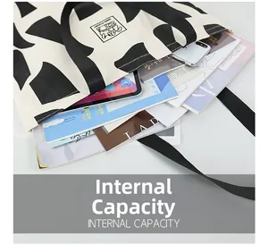Top view of large capacity canvas tote bag showing interior space for books and tablet