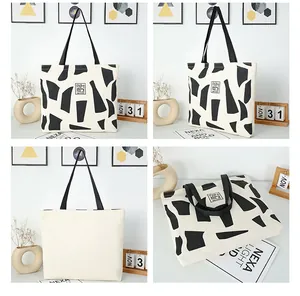 Four-angle view of large canvas tote bag with geometric print and black handles