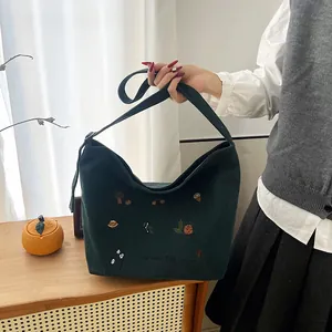 Deep green corduroy tote bag with harvest embroidery for stylish autumn daily commuting