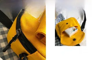 Detail showing the inner pocket of a yellow canvas crossbody bag with metal snap button