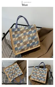 Detail view of the blue checkered canvas tote bag with woven handles for daily commute