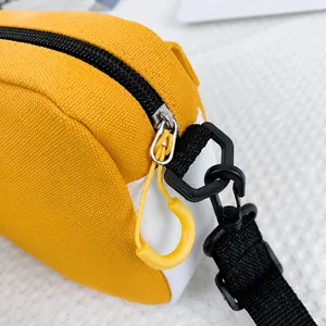 Detail of canvas shoulder bag showing smooth black zipper and durable nylon strap