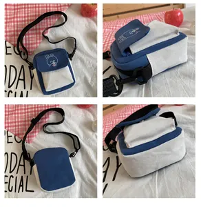 Detailed close-up of a mini canvas crossbody bag with cute rabbit embroidery detail