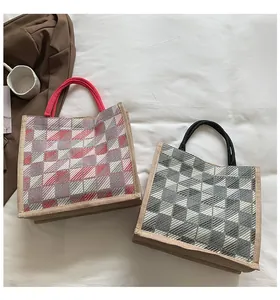 Detail of woven canvas tote bags with checkered pattern and durable hemp fabric edges