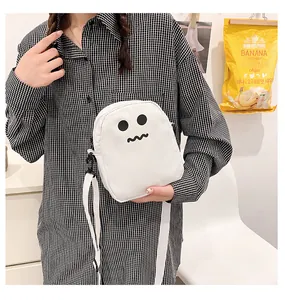 Close-up of the adjustable nylon strap and black buckle on the white ghost crossbody bag