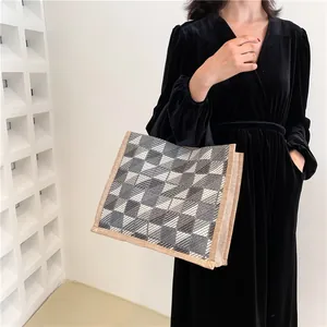 Fashionable grey checkered canvas tote bag with woven trim for students and office commute