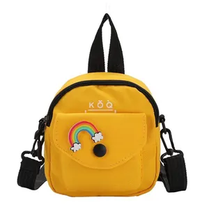 Cute yellow canvas crossbody bag with rainbow patch and black adjustable straps