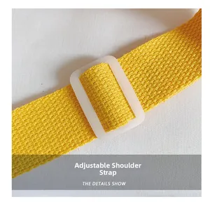 Detail of adjustable bright yellow woven shoulder strap with white plastic buckle