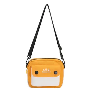 Japanese style canvas mini square crossbody bag in yellow and white with KǑQ̀ logo