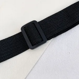 Close-up of the adjustable black nylon shoulder strap with a sturdy plastic buckle