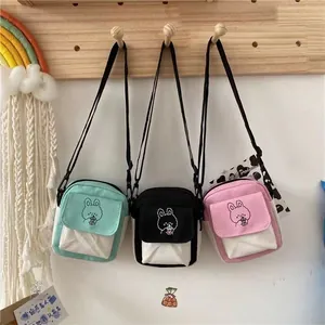 Cute canvas crossbody bags for women in mint green, black, and pink with rabbit prints