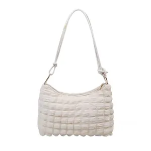 White faux fur hobo shoulder bag with quilted bubble texture and knotted strap detail