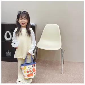 Close-up of beige knit vest and matching trousers with a cute cat pattern canvas tote bag
