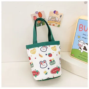 Close-up of a cute cartoon canvas tote bag with rabbit and strawberry prints