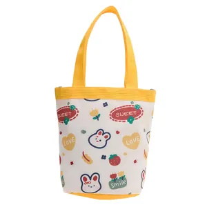 Cute canvas tote bag with yellow handles and cartoon bunny print for office lunch