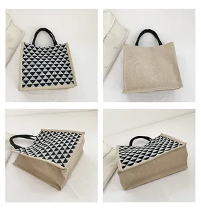 Detailed four-way views of a geometric linen tote bag with black triangle pattern