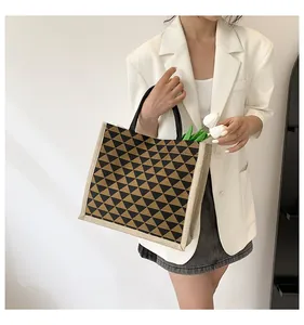 Chic linen tote bag with geometric triangle patterns showing spacious interior capacity