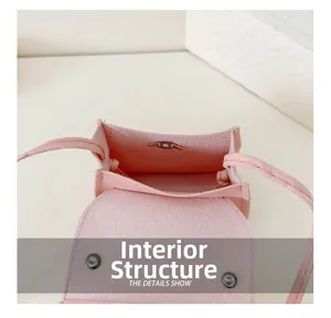 Internal structure showing the single compartment and magnetic snap of pink girl's bag