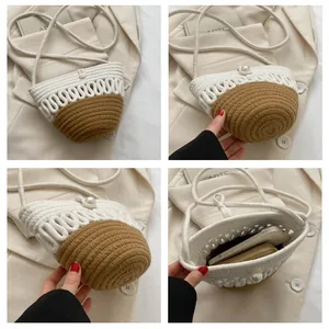 Detail view of woven bucket bag showing pearl buckle and compact interior capacity