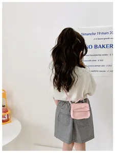 Toddler girl pink crossbody bag with bow detail and adjustable shoulder strap