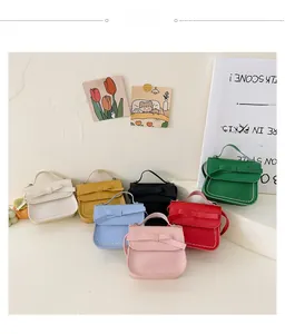 Detailed view of mini crossbody bags for girls in seven vibrant colors with bow details