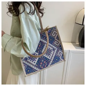 Detail of bohemian geometric jacquard woven tote bag with wide straps for women