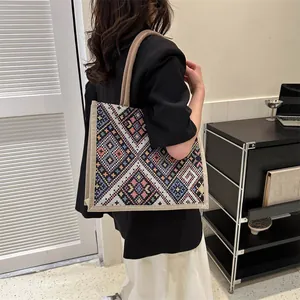 Ethnic geometric jacquard tote bag featuring colorful embroidery and woven texture