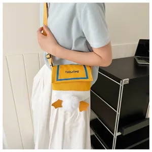 Adjustable canvas shoulder bag with cute cartoon duck tail and plush fur ball details