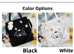 Vue détaillée du sac cabas en toile avec motifs chiots et sangles réglables en noir et blanc