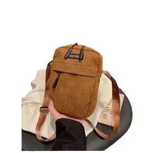 Vintage brown corduroy crossbody phone bag for women with adjustable strap and dual zippers