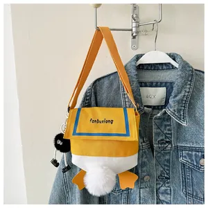 Close-up of cute yellow duck-themed canvas crossbody bag with nautical sailor collar details