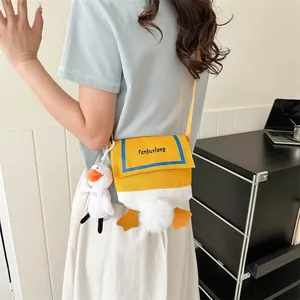 Cute cartoon duck canvas crossbody bag for women with plush tail and orange feet details
