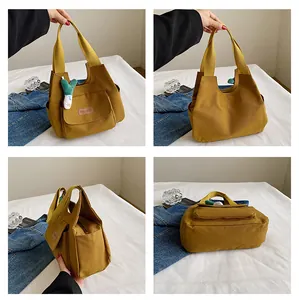 Detailed views of yellow canvas tote bag with fashion tag and green plush charm