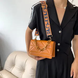 Caramel quilted PU leather crossbody bag with acrylic chain and wide printed strap