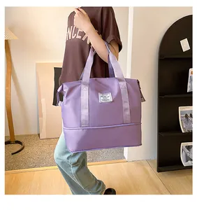Detail showing lavender waterproof nylon travel tote with expandable bottom and fashion label