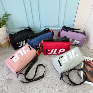 Japanese style cylinder crossbody bag in six colors with JLP logo and adjustable straps