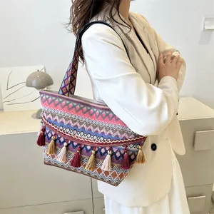 Ethnic knit tote bag with colorful geometric patterns, tassels and wide shoulder strap