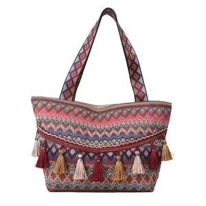 Bohemian woven shoulder tote bag with colorful ethnic patterns and tassel charms