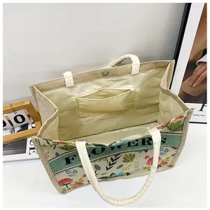 Interior view of vintage linen tote bag featuring a zipper pocket and magnetic buckle