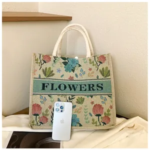 Close-up of vintage floral jacquard tote bag with FLOWERS embroidery and rope handles