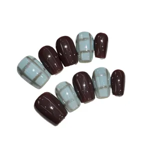 Glossy hazy blue plaid and dark coffee brown press-on nails in a short square shape