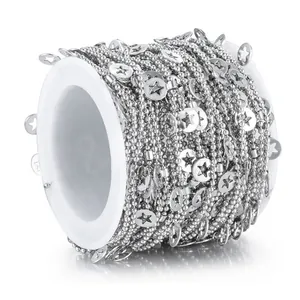 Stainless steel ball chain with star charms on a white spool for DIY jewelry making