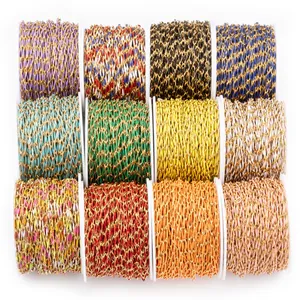 Colorful stainless steel lip chains on white spools for DIY jewelry making