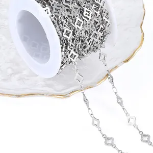 Detail of silver clover-shaped stainless steel chain on a roll for DIY jewelry making