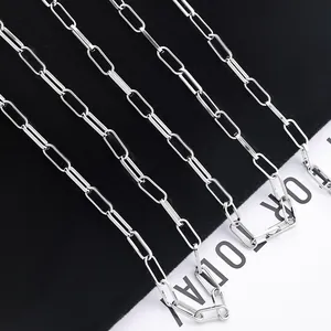 Macro view of polished silver paperclip chain links with shiny metallic texture