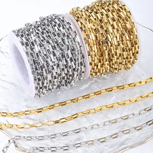 Gold and silver stainless steel box chains for DIY jewelry making displayed on a tray