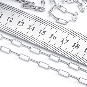 Detail of stainless steel oval chain link measuring 10-12mm length with metal ruler