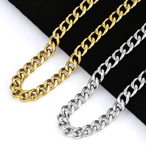 Detailed close-up of gold and silver stainless steel Cuban link chains on velvet