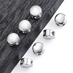 Close-up of high-polish stainless steel slide beads with holes for DIY jewelry making